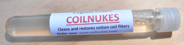 One ounce container of CoilNikes solution.